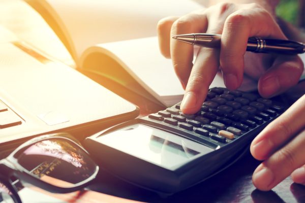 Man reviews tax debt management strategy at a desk