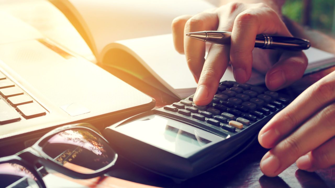 Man reviews tax debt management strategy at a desk