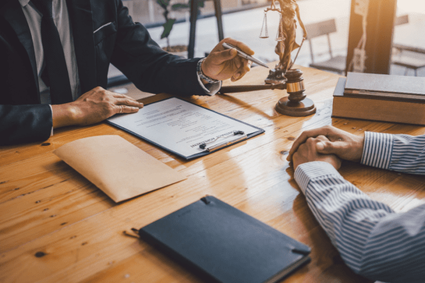 Man meeting with a tax attorney for IRS debt relief options