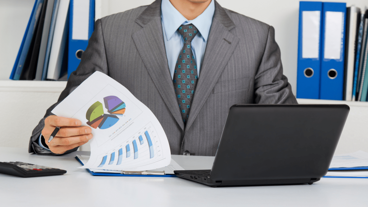 Man reviews IRS Form 1099-C and a chart comparing taxable and non-taxable canceled debt.