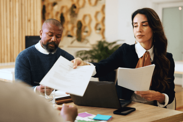 Tax professionals reviewing documents about IRS debt over 10 years old and statute of limitations