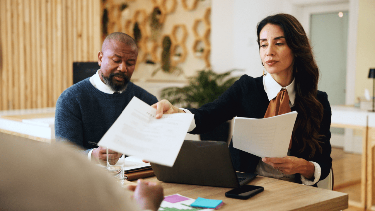 Tax professionals reviewing documents about IRS debt over 10 years old and statute of limitations