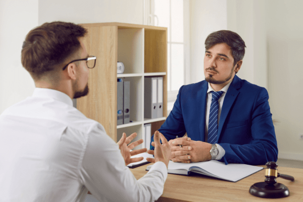 Professional attorney providing tax debt advice to a client in a legal consultation meeting