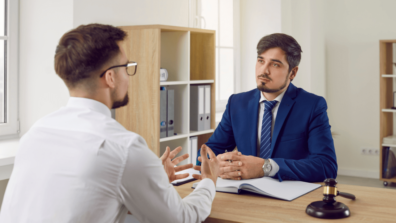 Professional attorney providing tax debt advice to a client in a legal consultation meeting
