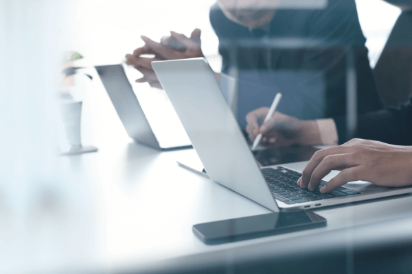 Tax professional researching how long can you go owing the IRS using laptop and financial analysis tools