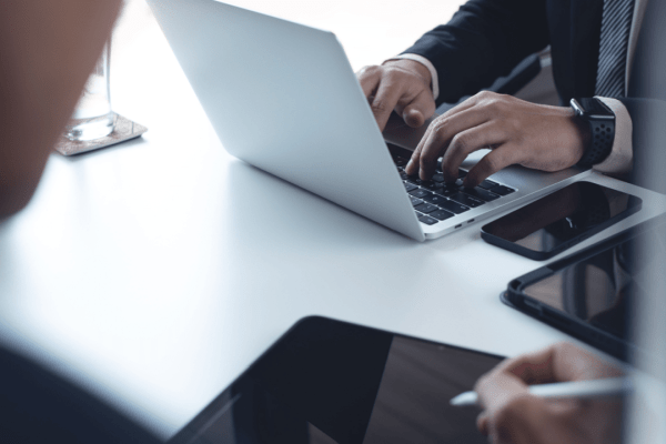 Professional calculating how much does Optima tax relief charge on laptop