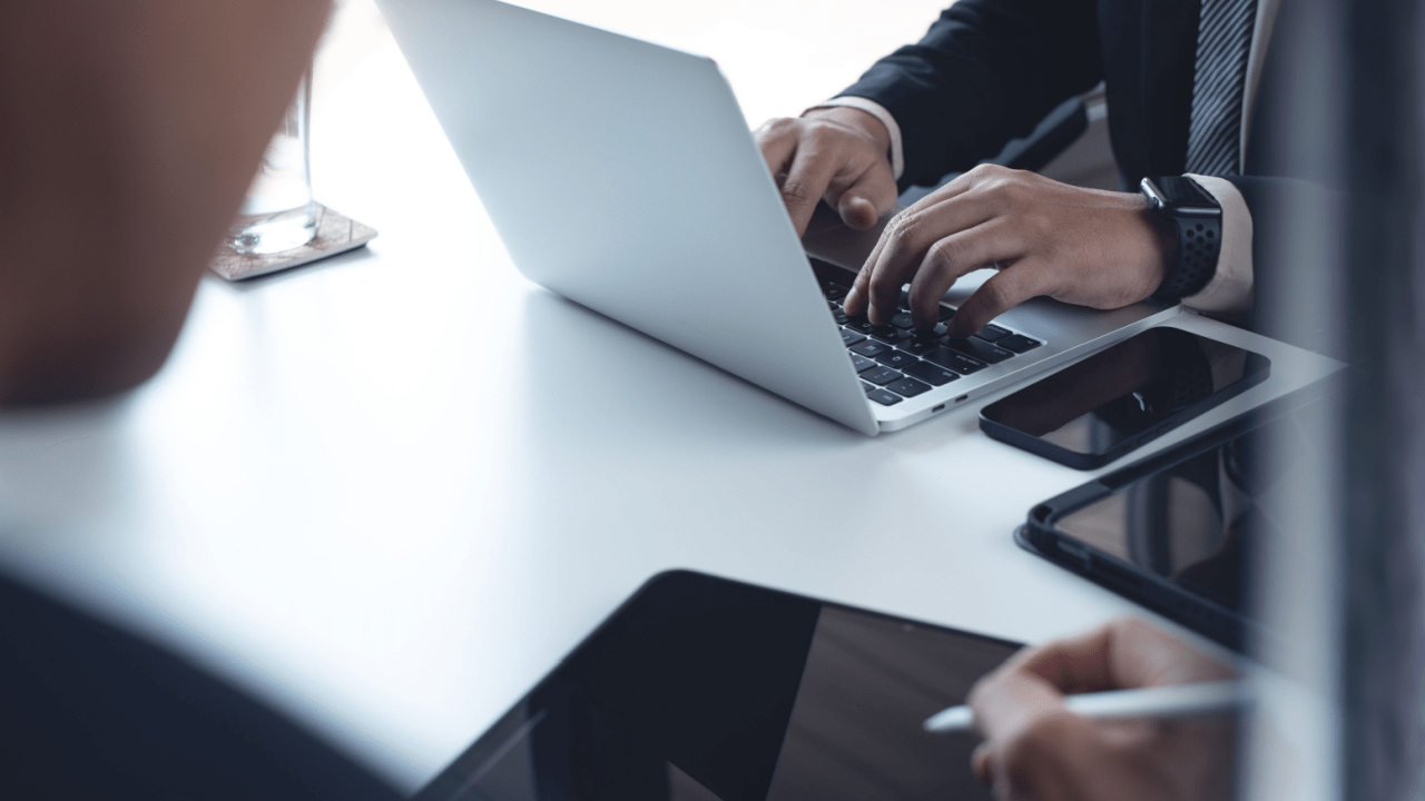 Professional calculating how much does Optima tax relief charge on laptop