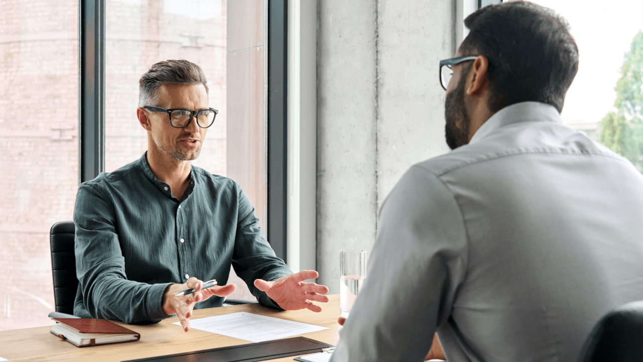 Professional tax advisor helping client with IRS debt near me during consultation meeting