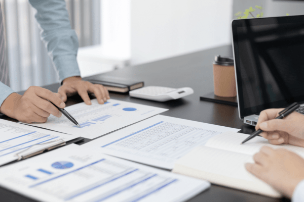 Tax advisor and client reviewing financial documents to determine who is eligible for the IRS hardship program
