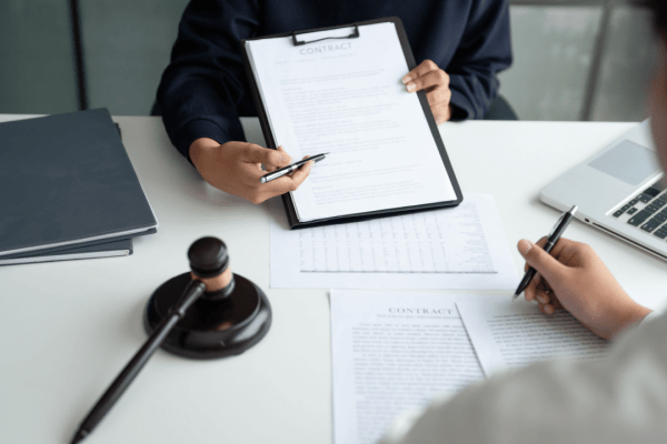 Tax lawyer consultation showing can tax lawyers really help with legal documents and gavel