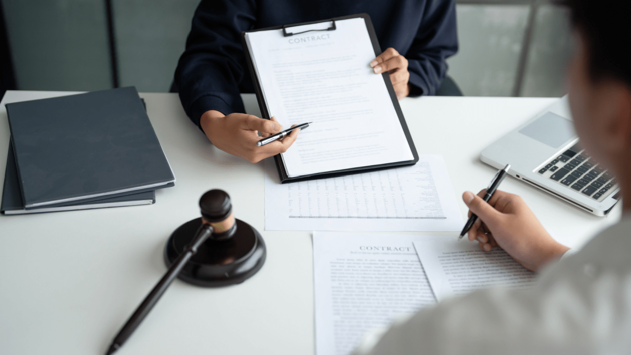 Tax lawyer consultation showing can tax lawyers really help with legal documents and gavel