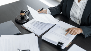 Tax attorney reviewing legal documents with gavel on desk helping clients who ask do I need a tax attorney for back taxes