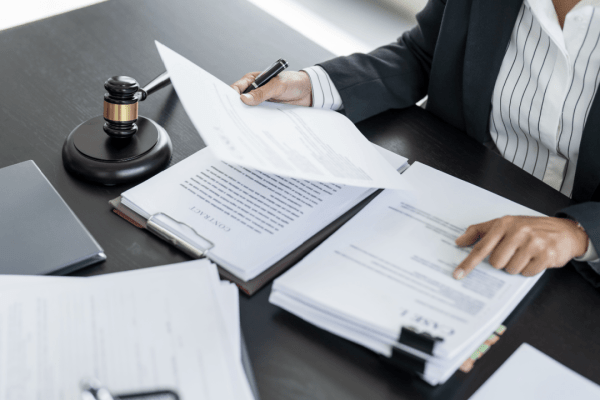 Tax attorney reviewing legal documents with gavel on desk helping clients who ask do I need a tax attorney for back taxes