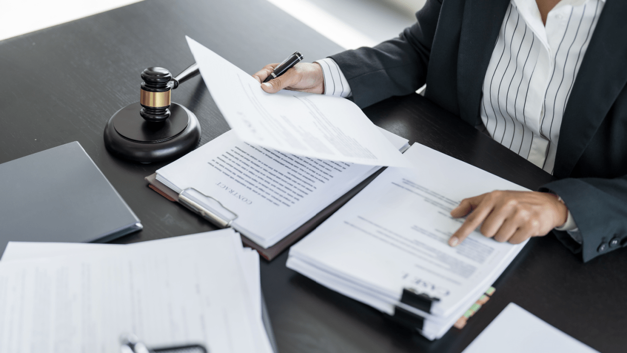 Tax attorney reviewing legal documents with gavel on desk helping clients who ask do I need a tax attorney for back taxes