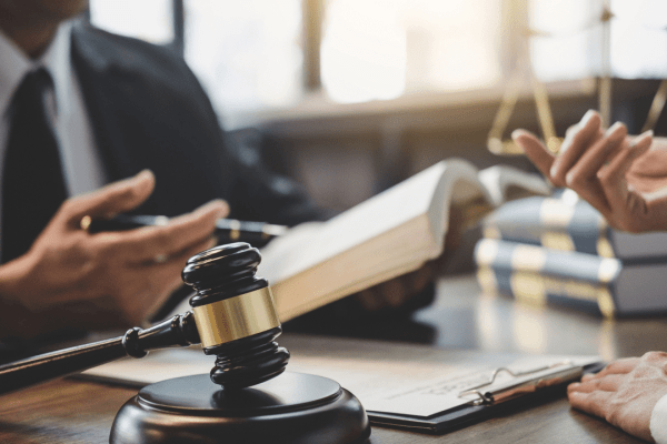 Tax attorney consultation showing how much does a tax lawyer cost in the US with legal documents and gavel