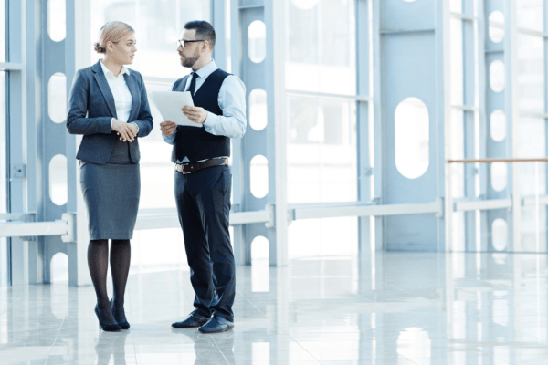 Professional consultation discussing cost of hiring a tax debt lawyer in modern office setting