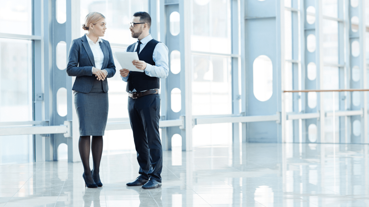 Professional consultation discussing cost of hiring a tax debt lawyer in modern office setting