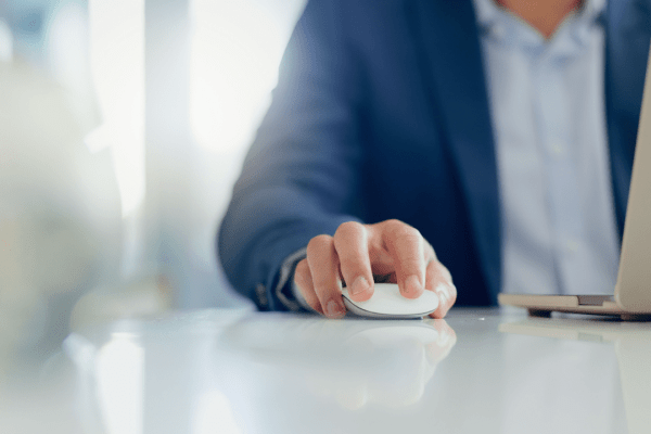 Professional businessman using computer mouse researching when and why to hire a tax lawyer