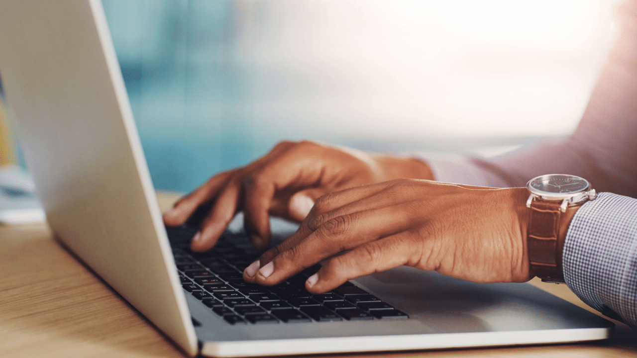 Professional hands typing on laptop researching when to seek a tax attorney for complex tax issues and legal representation needs