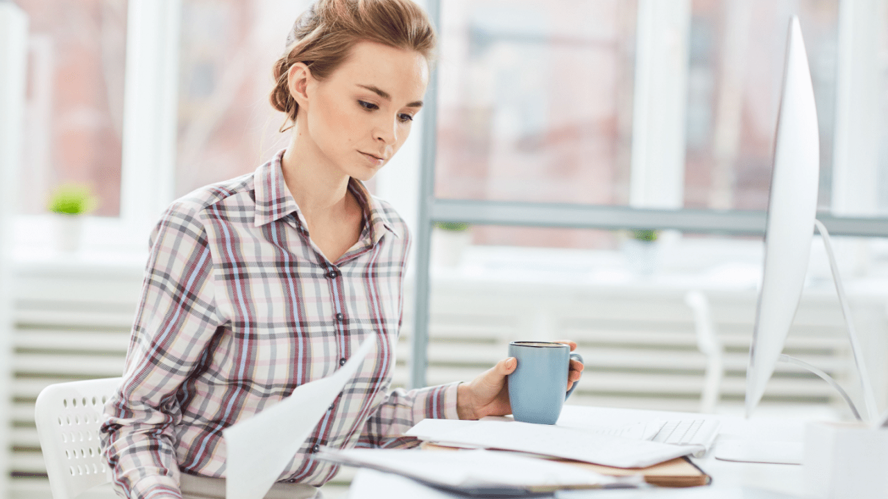 Woman reviewing tax documents to determine who qualifies for the IRS Fresh Start program