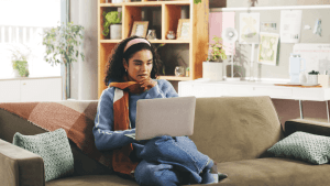 nderstanding What Qualifies for Innocent Spouse Relief - Woman Reviewing Tax Information Woman researching what qualifies for innocent spouse relief on laptop at home