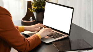 Person researching what's the difference between injured spouse relief and innocent spouse relief on laptop