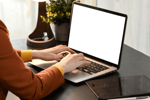 Person researching what's the difference between injured spouse relief and innocent spouse relief on laptop