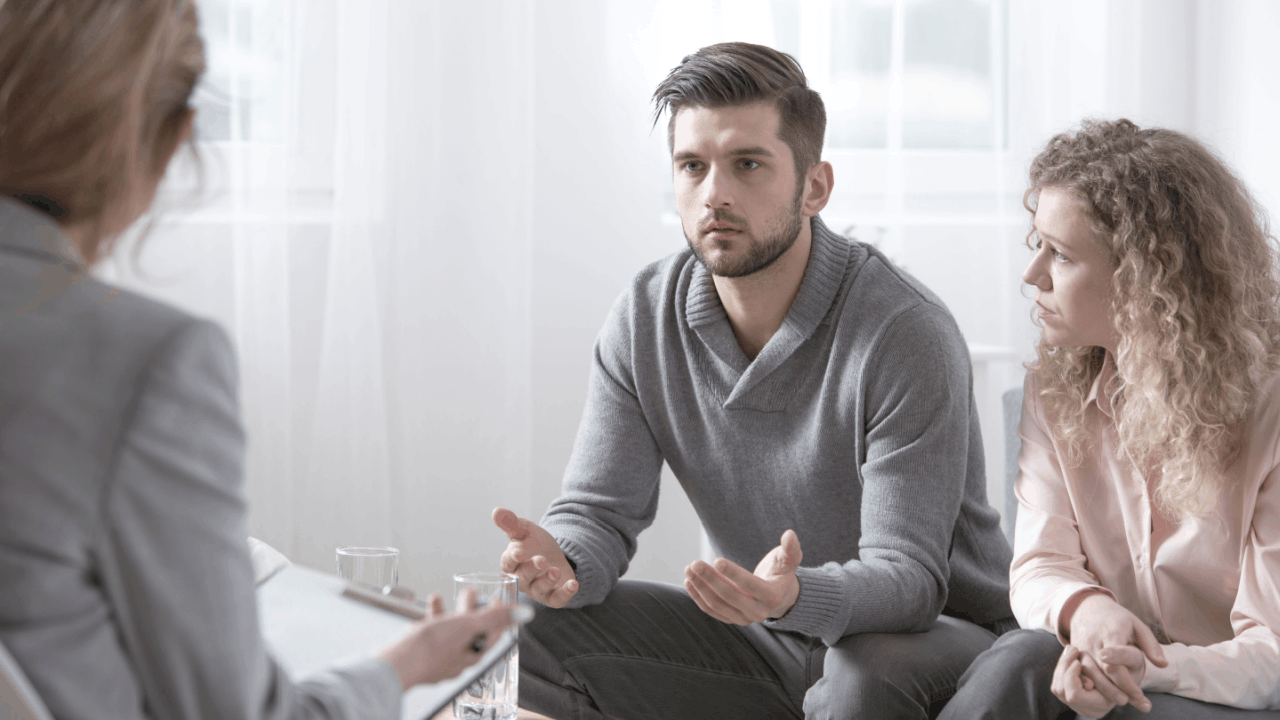 Couple seeking innocent spouse relief consultation with tax professional to understand IRS liability protection options