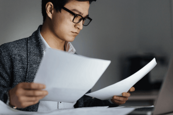 Taxpayer reviewing financial documents to determine what is the IRS hardship rule eligibility for Currently Not Collectible status