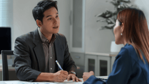 Tax professional explaining what is an example of innocent spouse relief to client during consultation