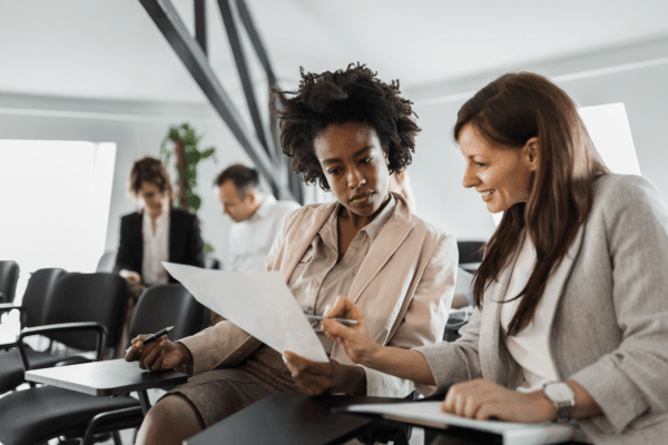 Tax attorney consulting with client about who qualifies for the IRS hardship program and reviewing financial documents