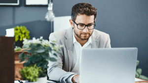 Professional tax attorney reviewing what is an example of a hardship for the IRS on laptop computer in modern office