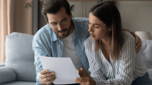 Married couple reviewing best tax strategy for married couples with financial documents