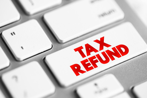 Keyboard key showing "TAX REFUND" in red text representing IRS refund garnishment protection and prevention strategies