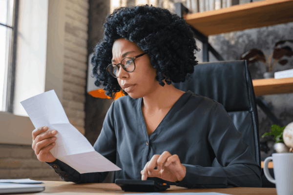 Woman reviewing documents about whether the IRS can take my refund if my husband owes child support