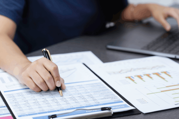 Taxpayer reviewing financial documents to claim overpayment relief from IRS within three-year lookback period