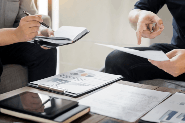 Tax professional explaining how to get innocent spouse relief while reviewing IRS documentation and requirements with client