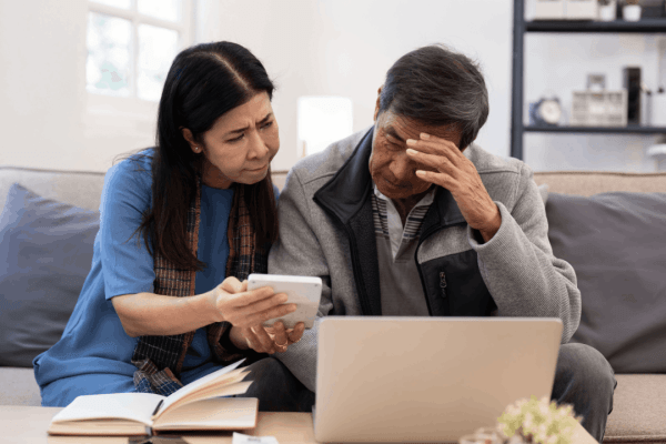 Should I file innocent spouse if injured spouse was denied - couple reviewing IRS tax relief forms