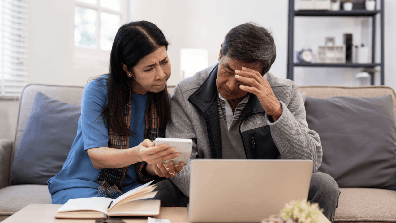 Should I file innocent spouse if injured spouse was denied - couple reviewing IRS tax relief forms