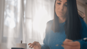 Woman researching what is the $3000 IRS refund online at home