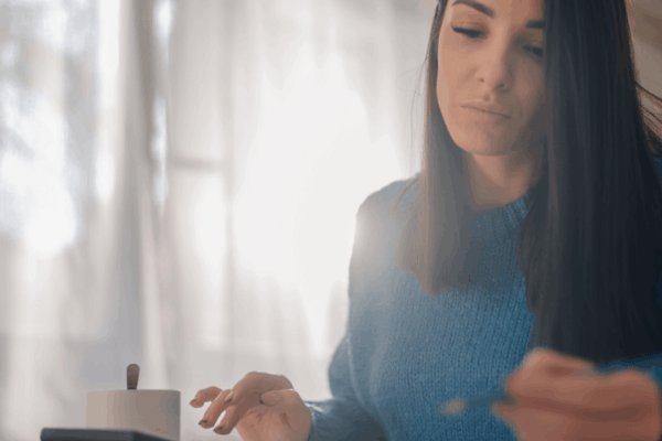 Woman researching what is the $3000 IRS refund online at home