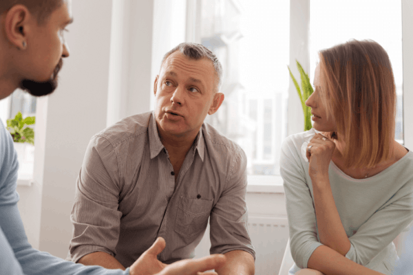 Couple consulting with tax professional about statute of limitations for innocent spouse relief and IRS tax debt options