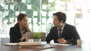 Tax professionals discussing what are the four types of innocent spouse relief during consultation meeting