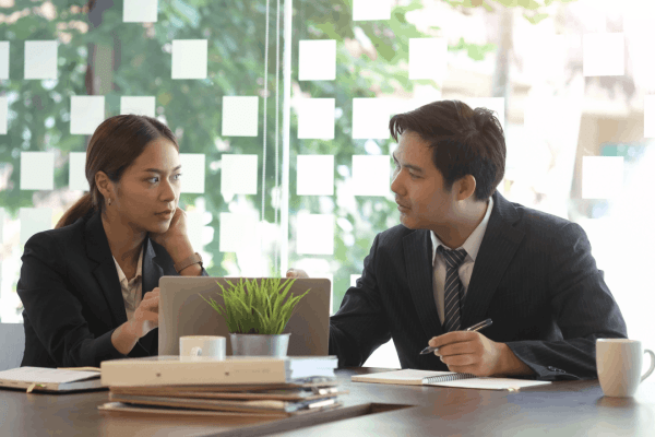 Tax professionals discussing what are the four types of innocent spouse relief during consultation meeting