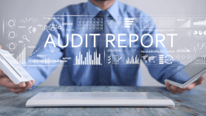 Does audit mean you owe money — IRS audit report dashboard with financial data and tax documents