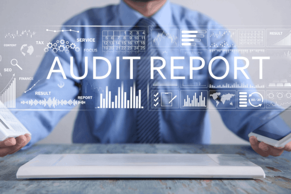 Does audit mean you owe money — IRS audit report dashboard with financial data and tax documents