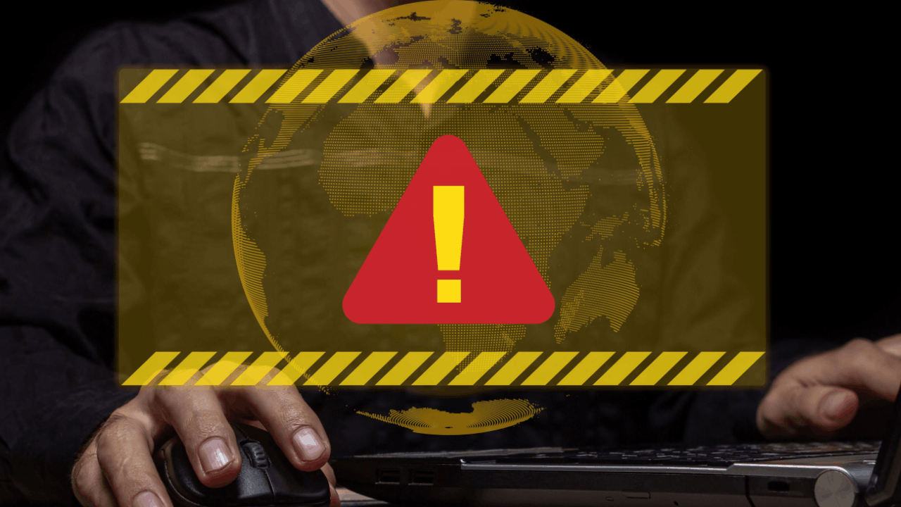 Warning alert symbol on a laptop screen representing some red flags that can trigger a tax audit