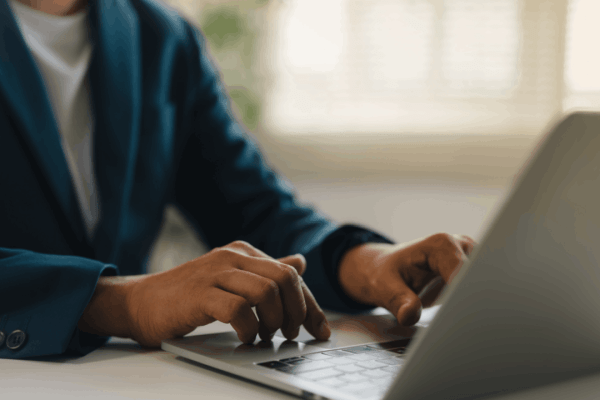 Bonus depreciation 2026 – business professional typing on a laptop to research updated tax deduction rules