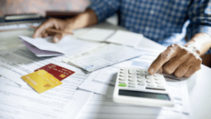 Bonus depreciation calculation worksheet with calculator and financial documents