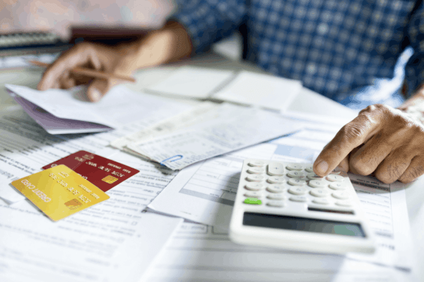 Bonus depreciation calculation worksheet with calculator and financial documents